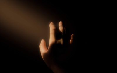 Close up of a focused light beam in a dark room